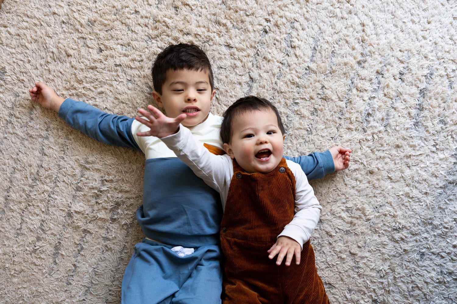 two brothers laying together during Roswell family photography session